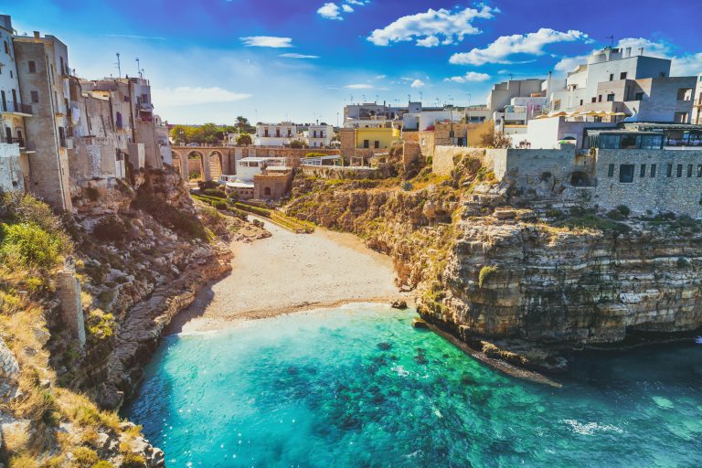 scenic-view-of-lama-monachile-cala-porto-beach-in-polignano-a-mare-italy